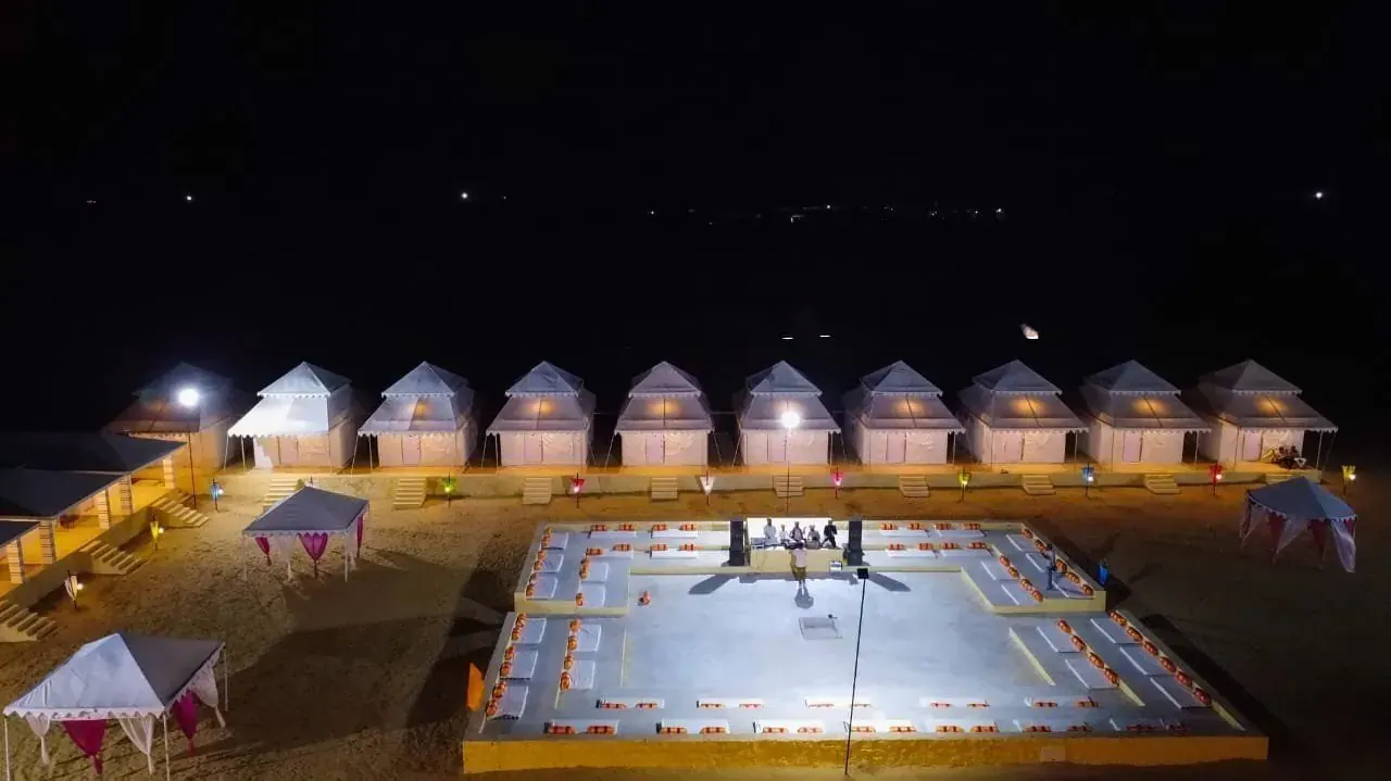 Illuminated Swiss tents at a desert camp in Sam, Jaisalmer at night